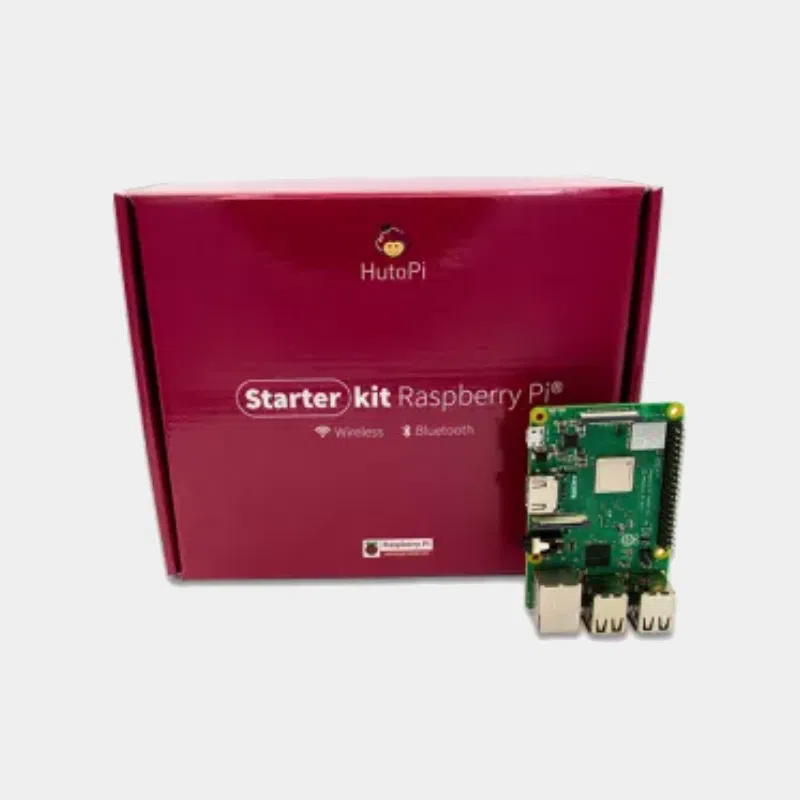 Boîte bordeaux du kit de démarrage avec carte Raspberry Pi 3 Model B+ posée devant