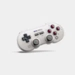 Manette 8BitDo SN30 Pro Bluetooth beige et grise vue de trois quarts avec ses joysticks