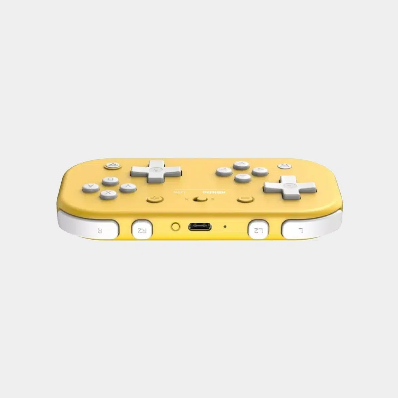 Manette 8BitDo Lite Pad jaune vue de profil avec port USB-C et boutons de tranche