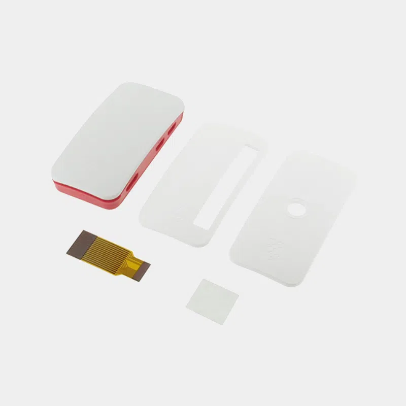Boîtier officiel Raspberry Pi Zero rouge et blanc démonté avec plaques intérieures