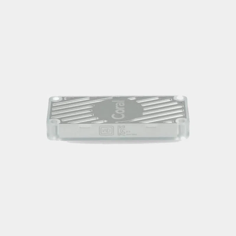 Accélérateur Google Coral USB gris vu de dessus avec logo Coral